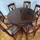 Round mahogany table and beech chairs.