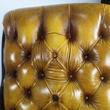 Pair of padded Chesterfield armchairs