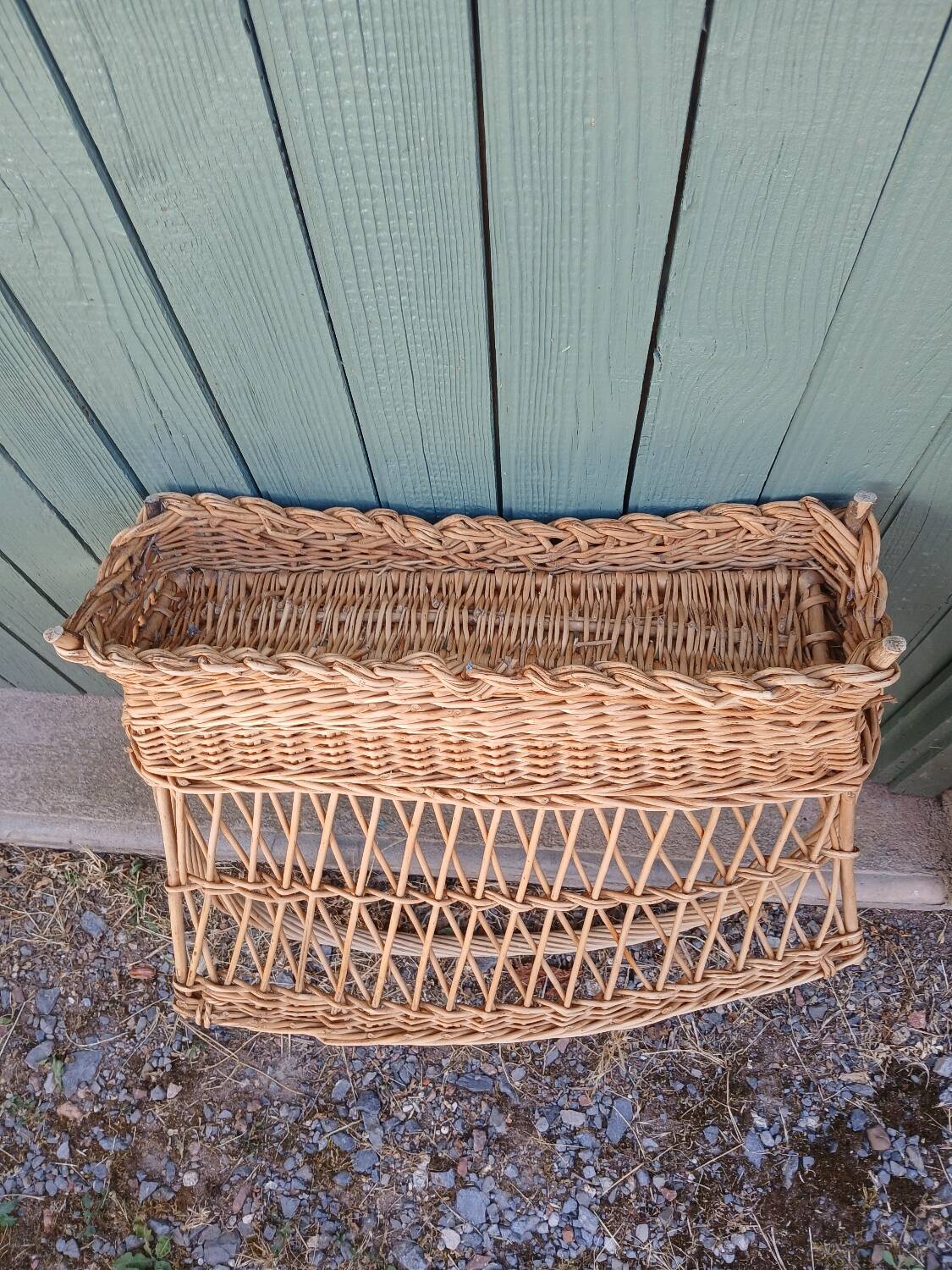 Antique wicker magazine rack