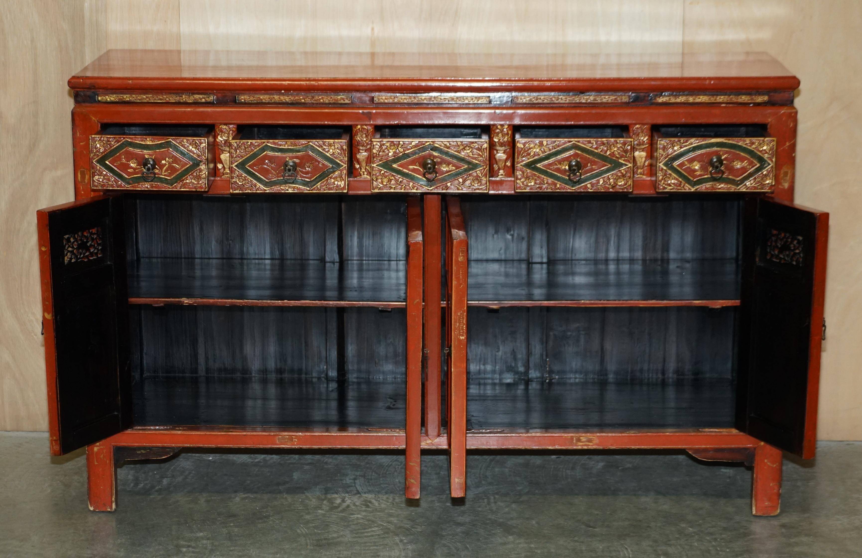 Vintage Chinese lacquered buffet decorated with gold leaf.