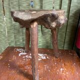 Old brutalist design wooden tripod stool
