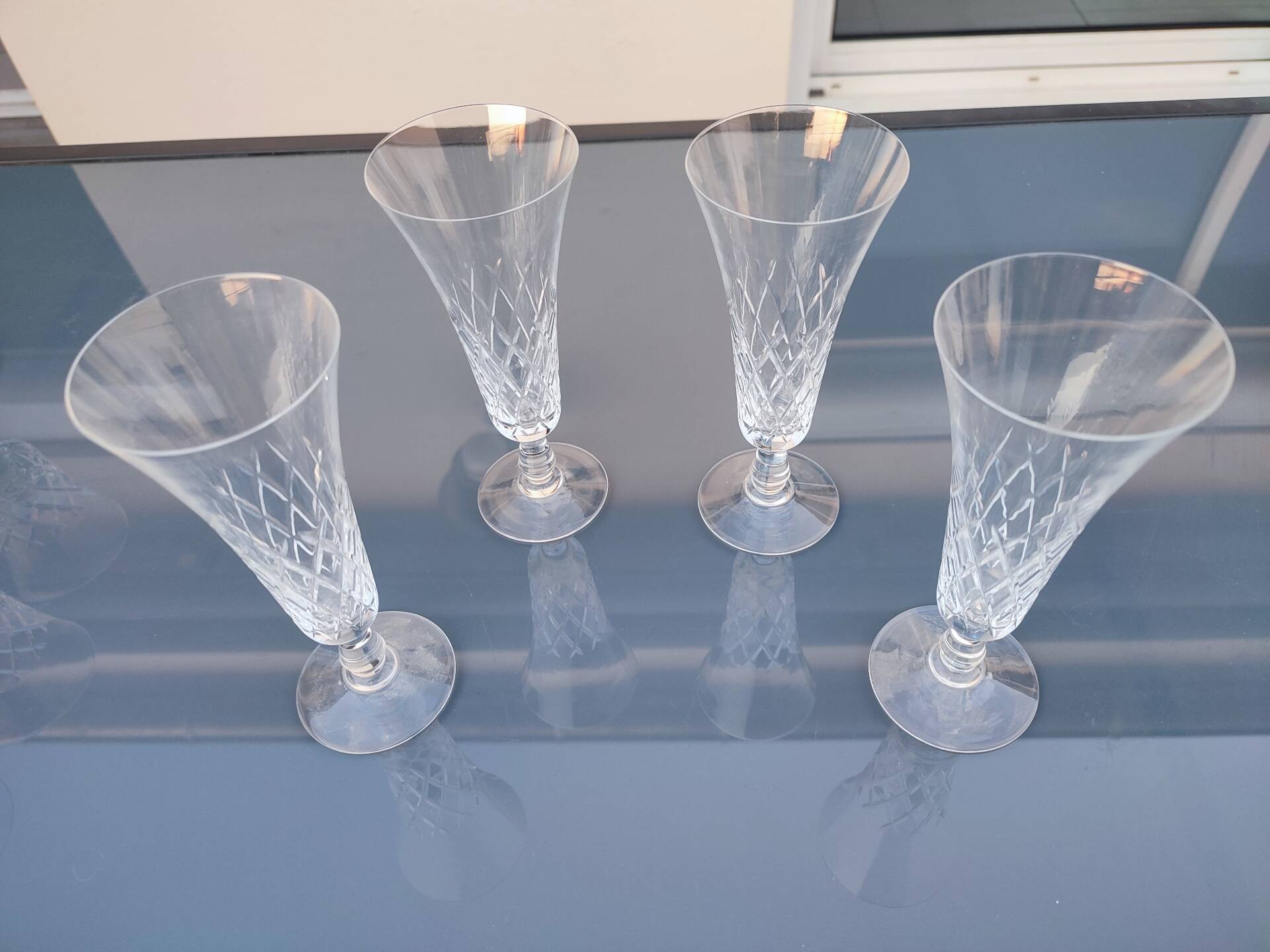 4 crystal champagne flutes in the crystalline style of Lorraine