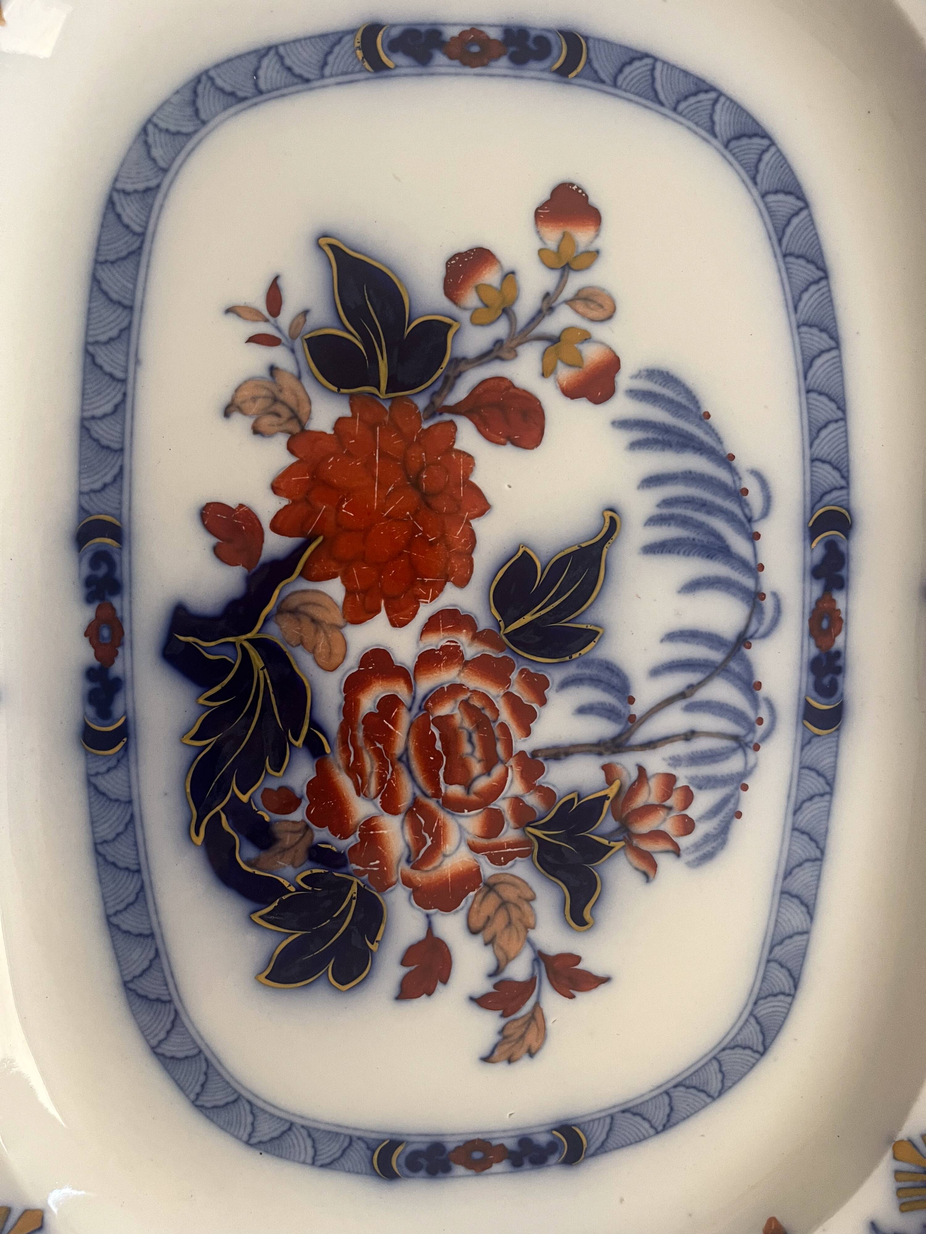 Large hollow dish in fine earthenware with Japanese decoration.