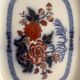 Large hollow dish in fine earthenware with Japanese decoration.