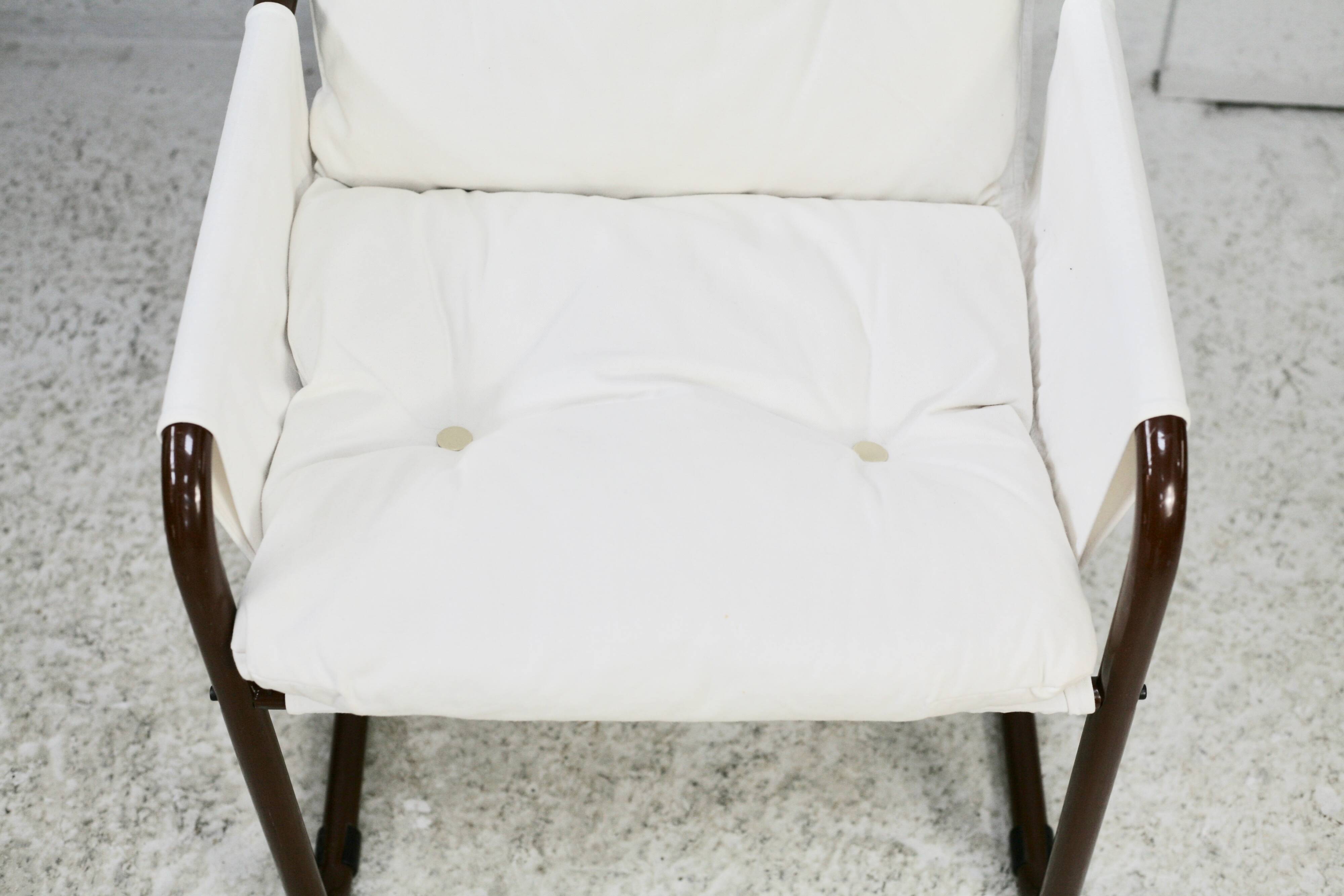 Tubular armchair, fabric suspended seat. Circa 1970