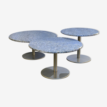 Nest of round granite and stainless steel salon tables