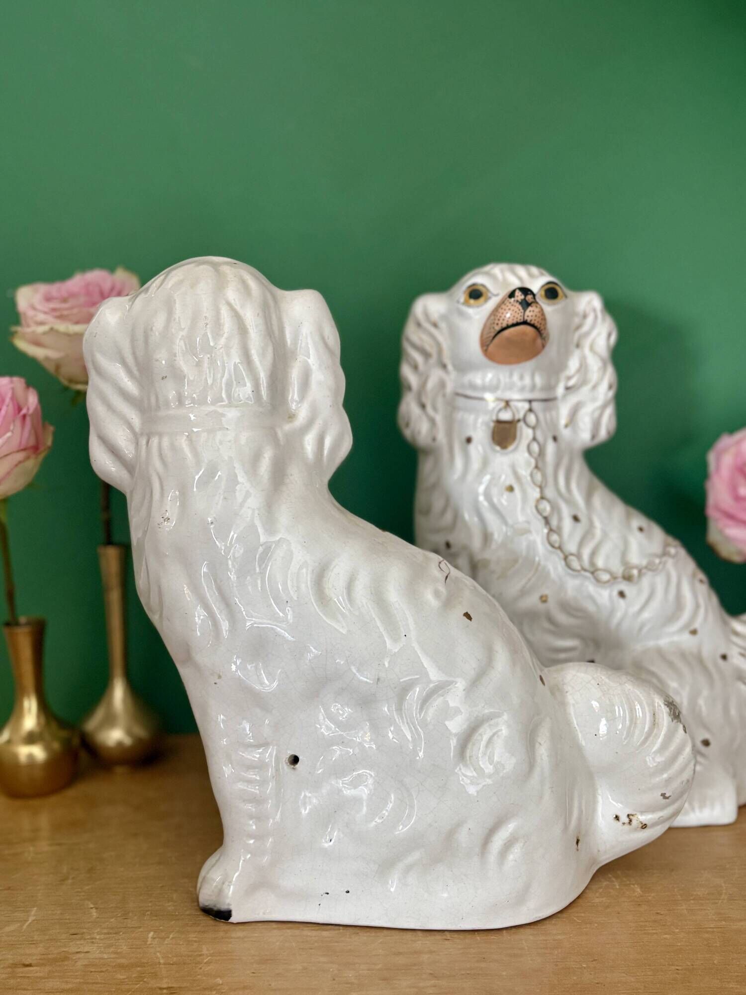 Pair of Staffordshire-type dogs in white and gold ceramic