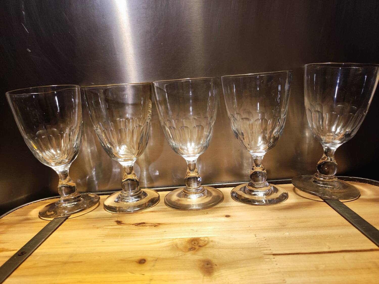 5 antique wine glasses with cut sides