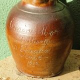 Large stoneware jug with a family name pattern, 1912