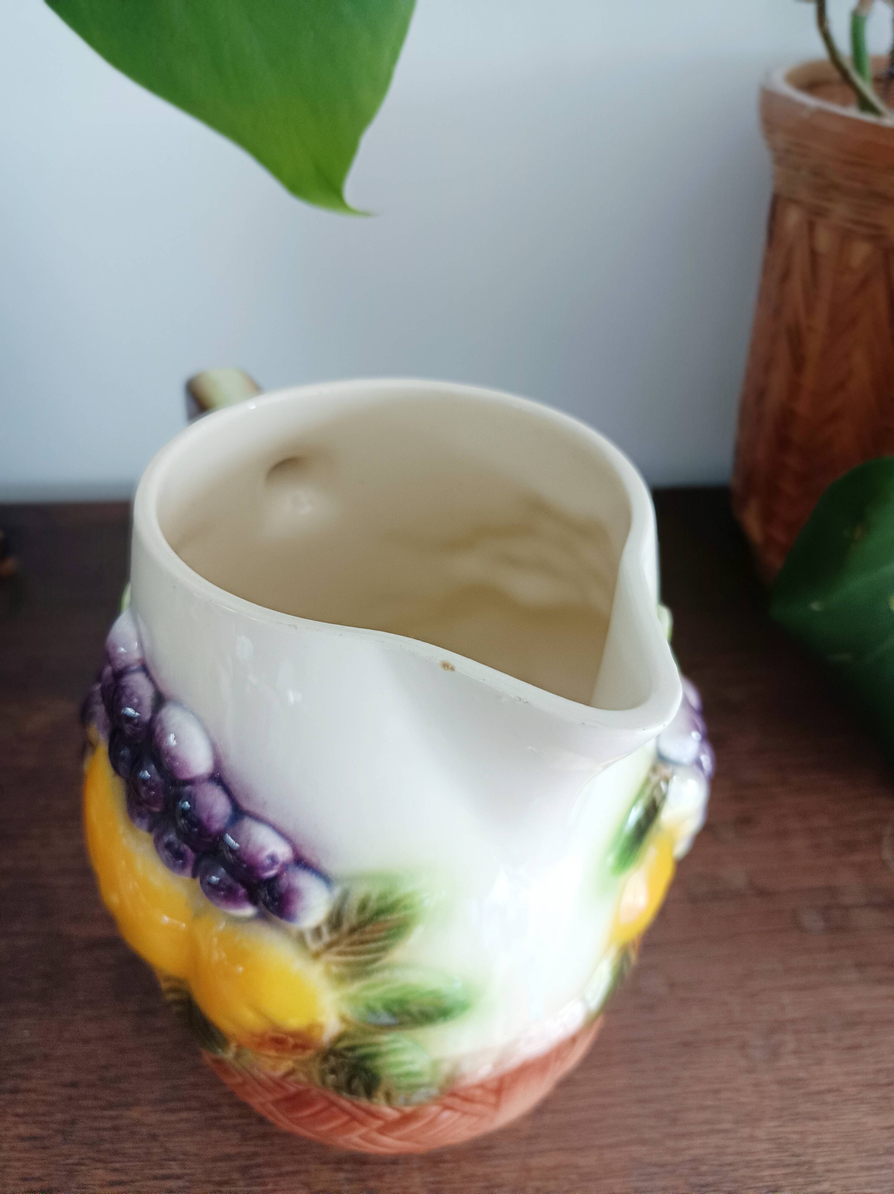 St-Clément pitcher in slip, fruit decoration