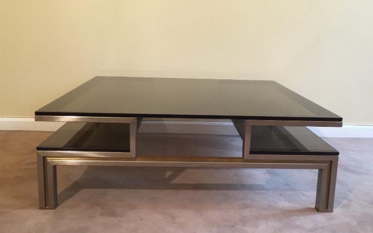 Very nice coffee table in brushed steel and brass