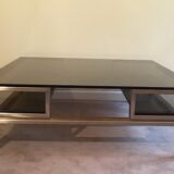 Très belle table basse en acier brossé et laiton