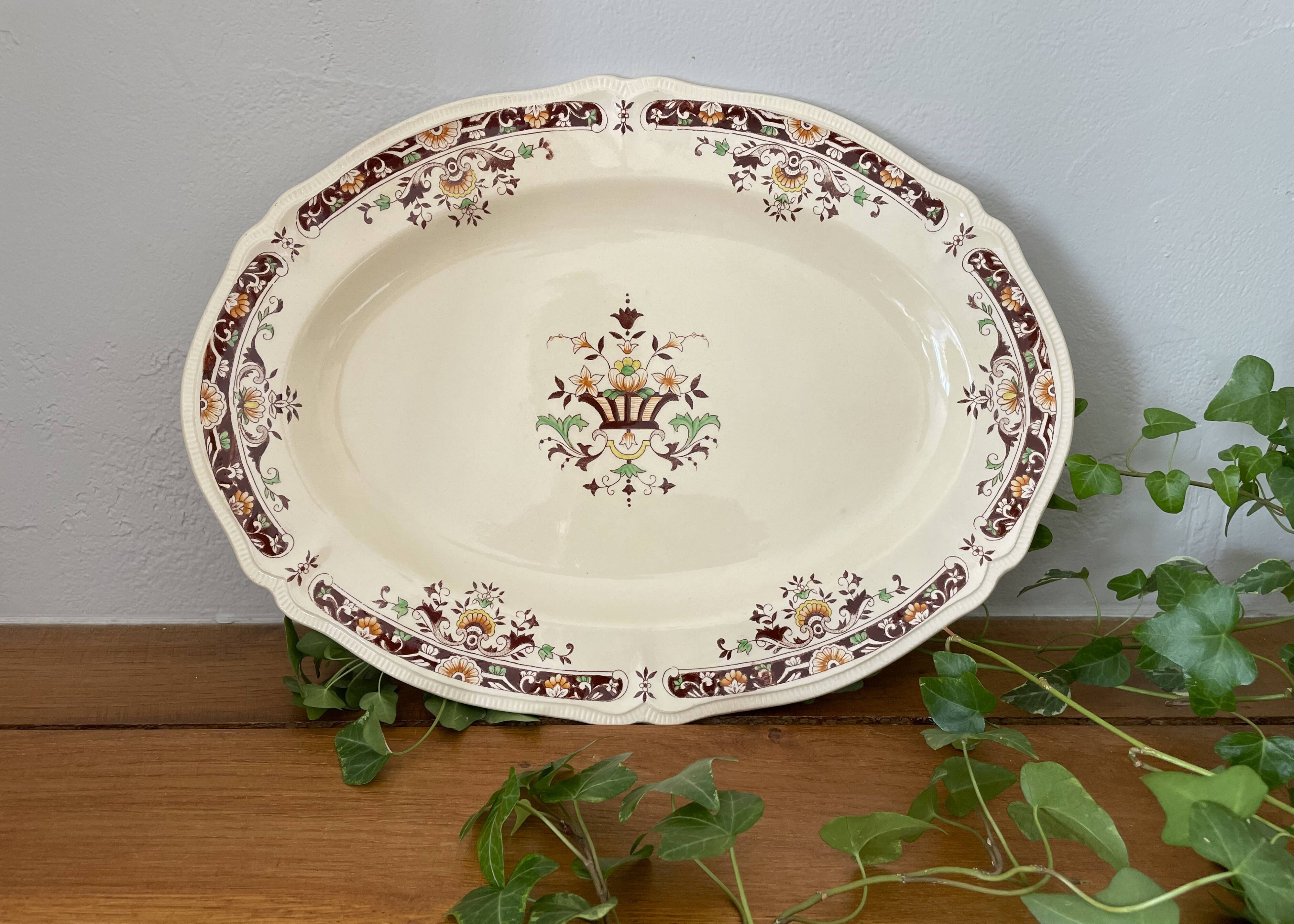 Antique serving dish in Longchamp earthenware.