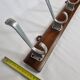Wall rack "Art Deco" in cast aluminum and wood, 3 hooks, 54 cm