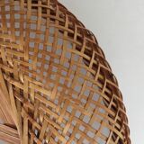 Braces of wood and woven rattan oval basket