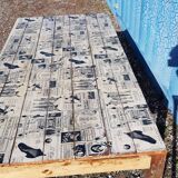 Teak dining table with illustrated top