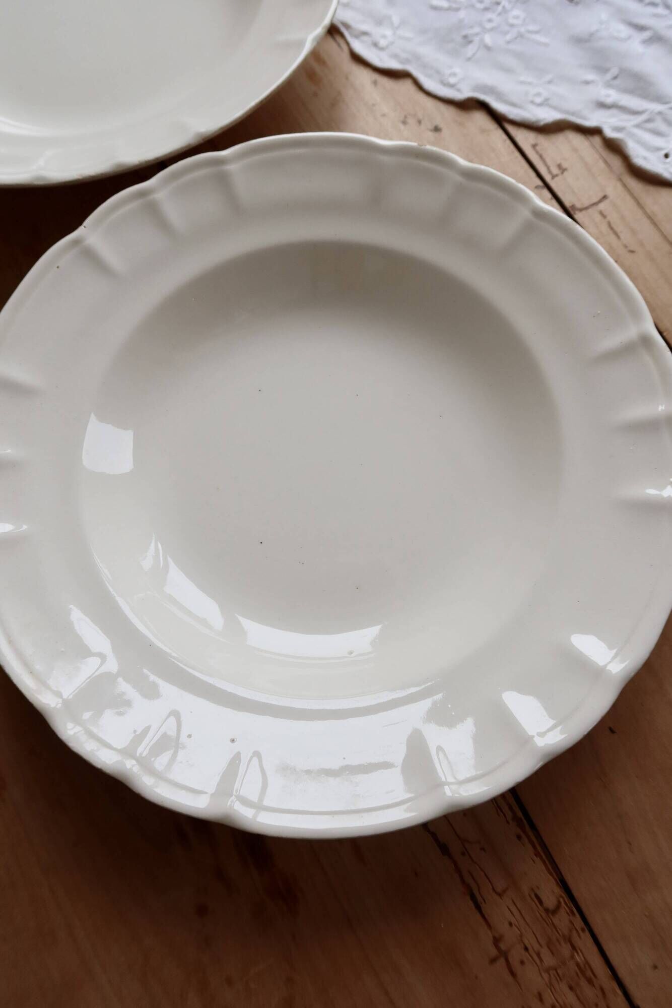 Pair of antique ivory faience deep plates ADP Luxcerae