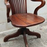 Old American office chair rounded around 1940 in oak