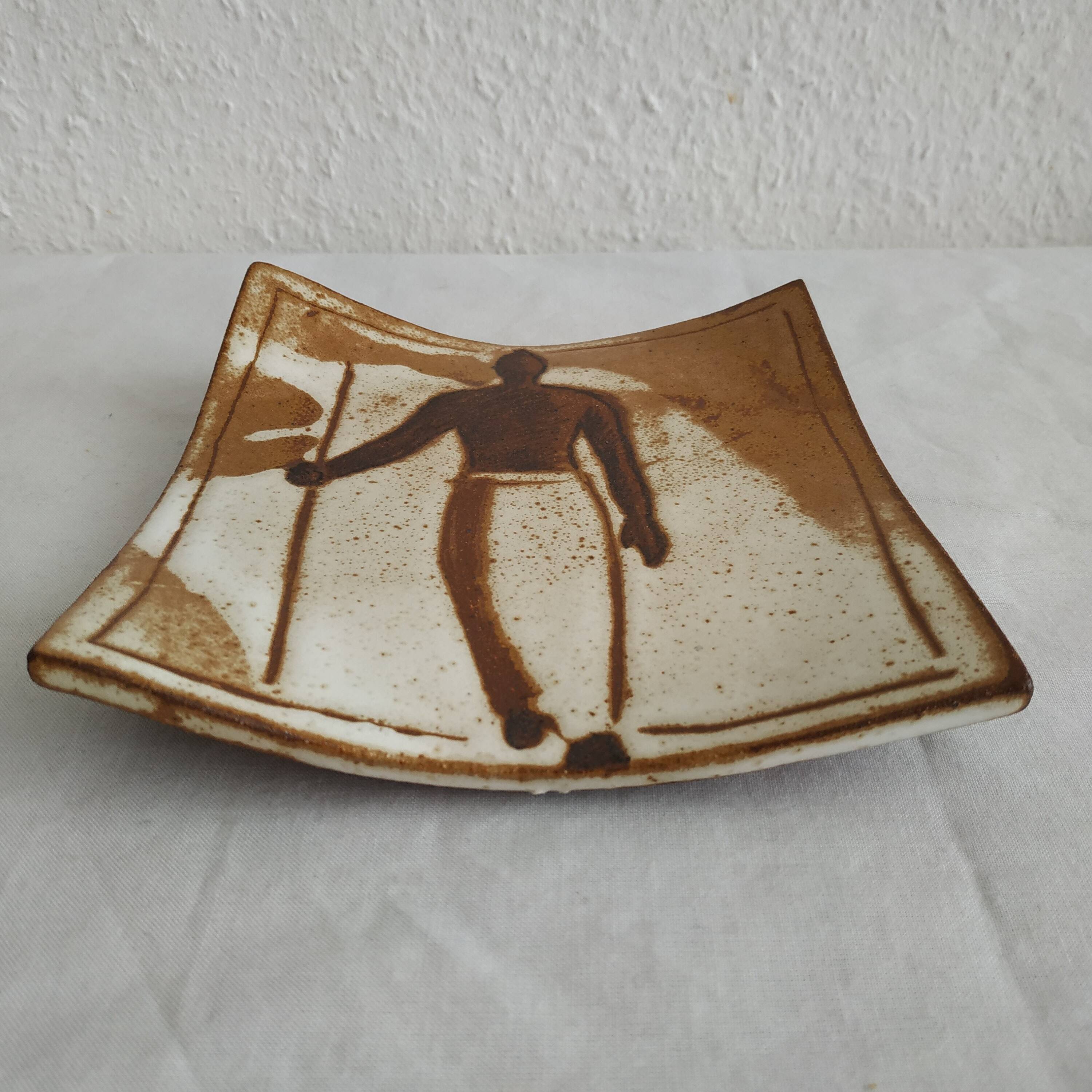 Two terracotta bowls with ethnic decoration and vintage signature.