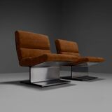 Very rare pair of leather and steel lounge chairs by Paul Geoffroy for Uginox