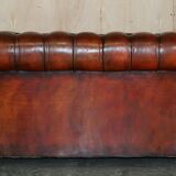 Pair of restored antique Chesterfield sofas in Boudreaux leather.
