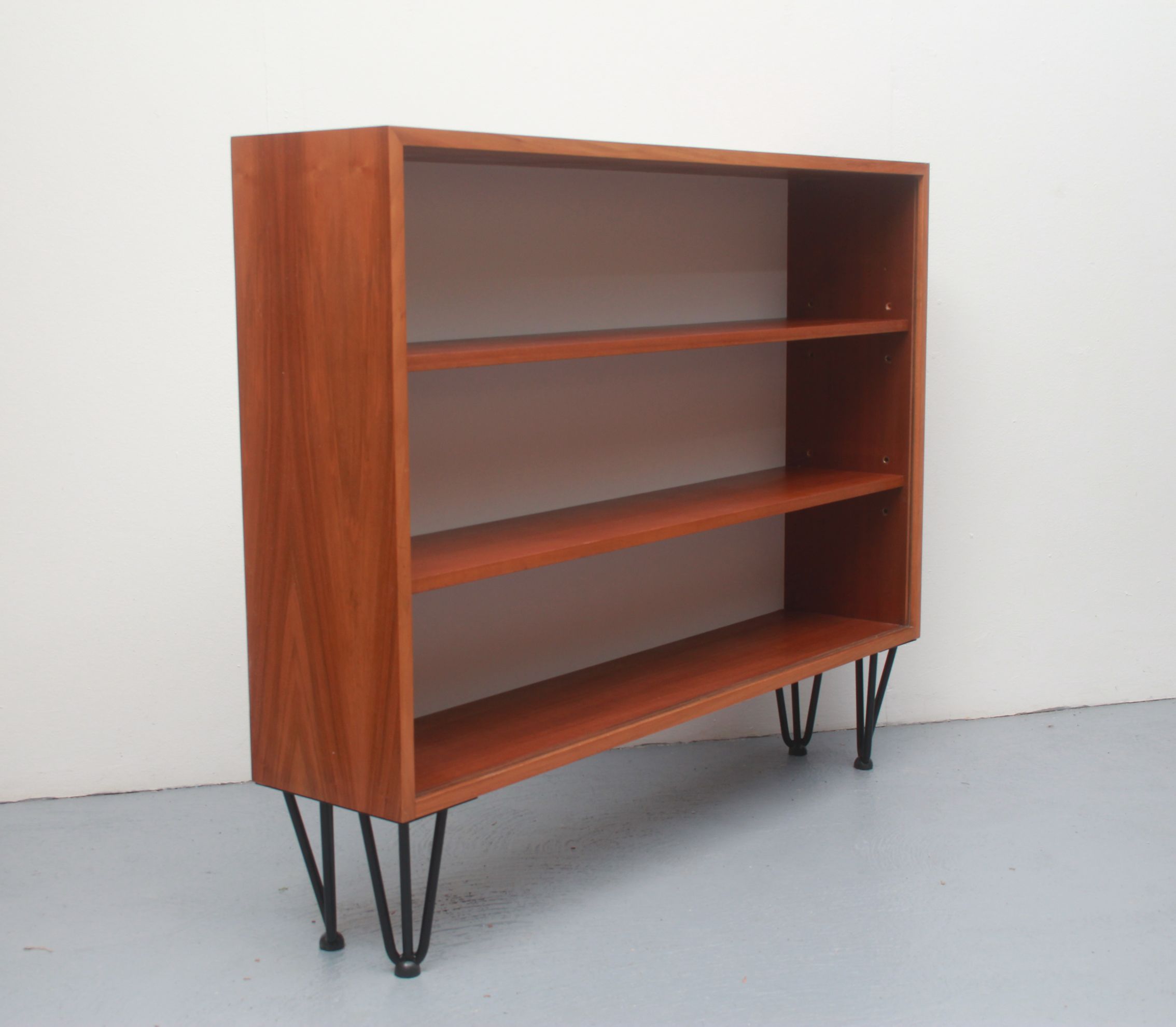 1960s book shelf in walnut, white back panel
