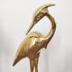 Couple large herons in polished golden brass