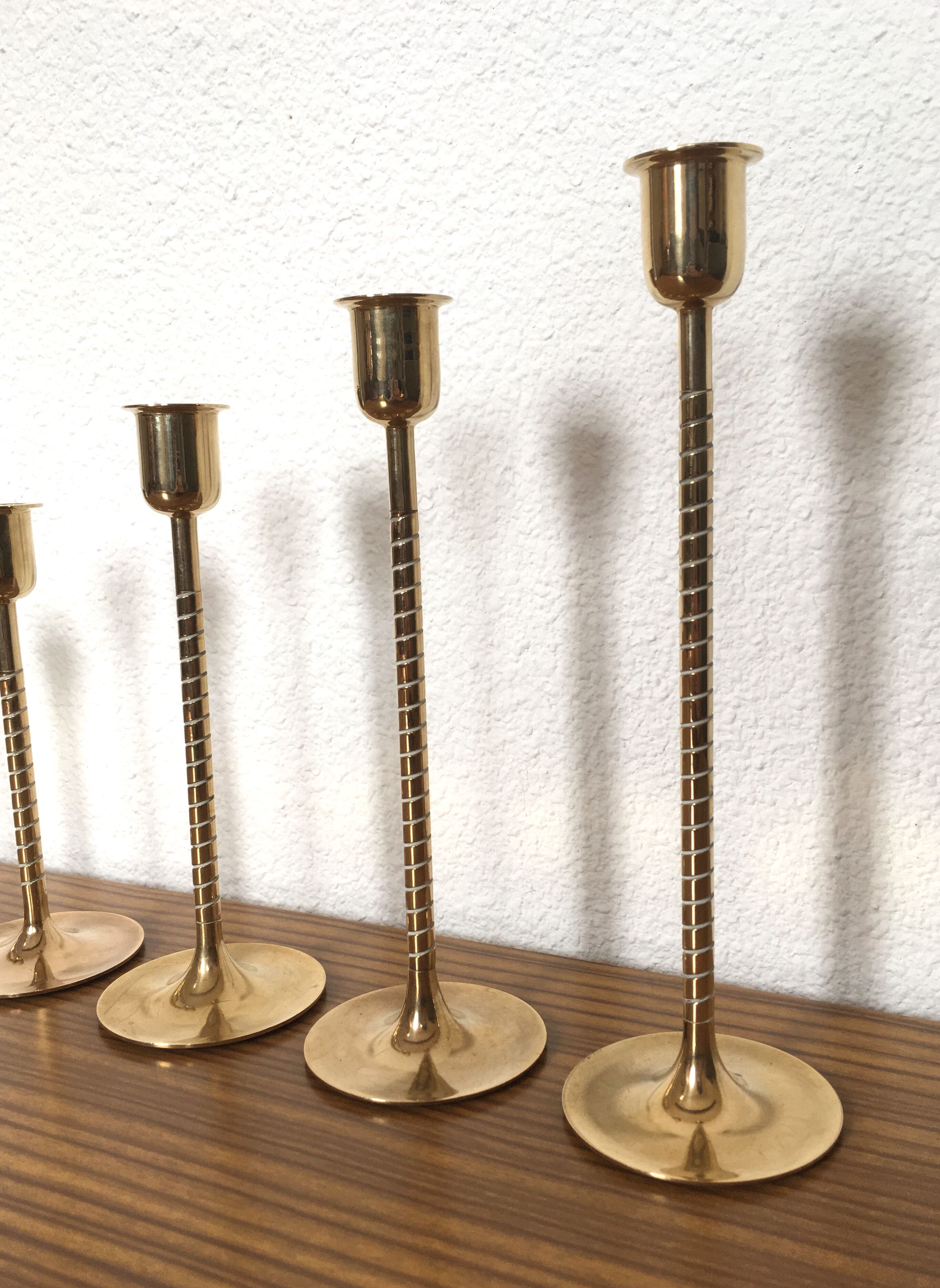 Series of 7 Scandinavian brass candlesticks