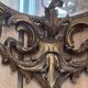 Large gilded wooden mirror, richly carved with winged dragons, 19th century