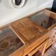 Counter, glass-fronted wooden workbench in dark wood, 8 drawers.