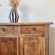 Buffet parisien bas ancien en bois patiné - intérieur fleuri