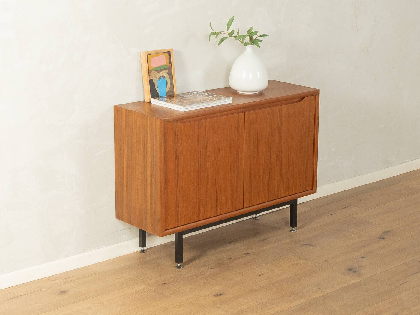 Classic chest of drawers from the 1960s with practical, closed storage space