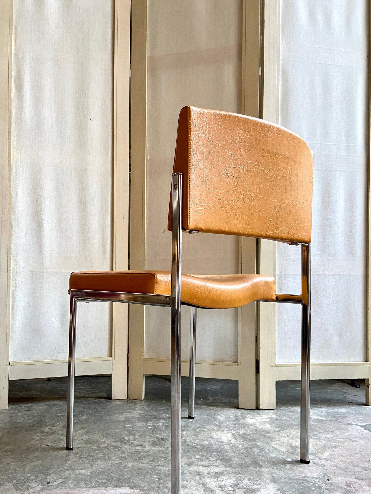 Chair in chromed metal and ochre skaï 1970s