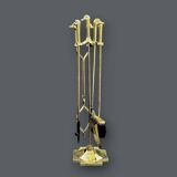 Antique fireplace tool in gilded zamak with duck head designs.