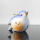 Vintage bird salt cellar in blue and white porcelain.