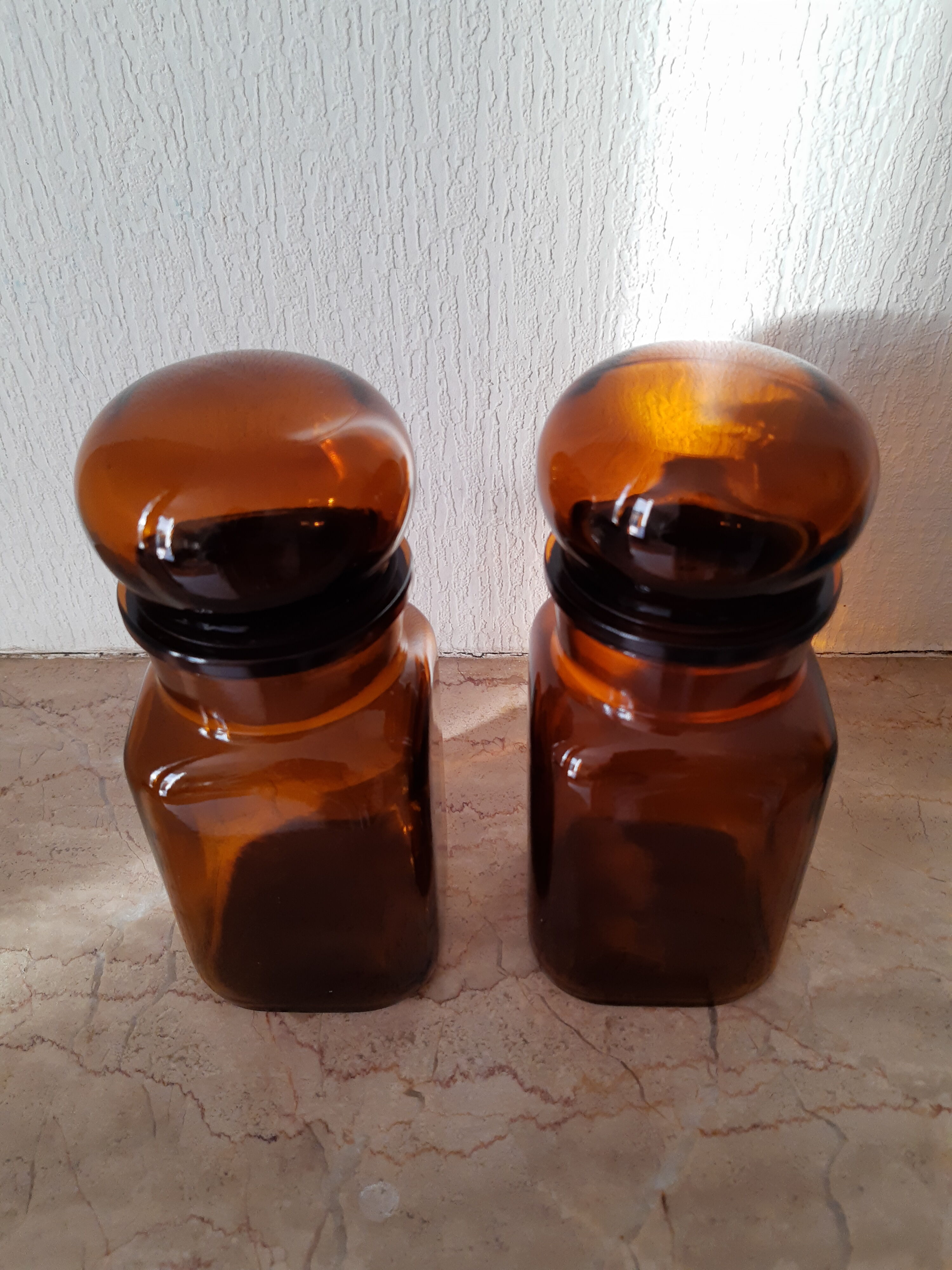 Pair of vintage amber glass jars