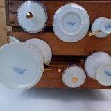 Coffee pot, sugar pot, 1 cup and saucer.