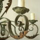 Lustre 8 branches en fer forgé patine gris de vert  et dorure ancien