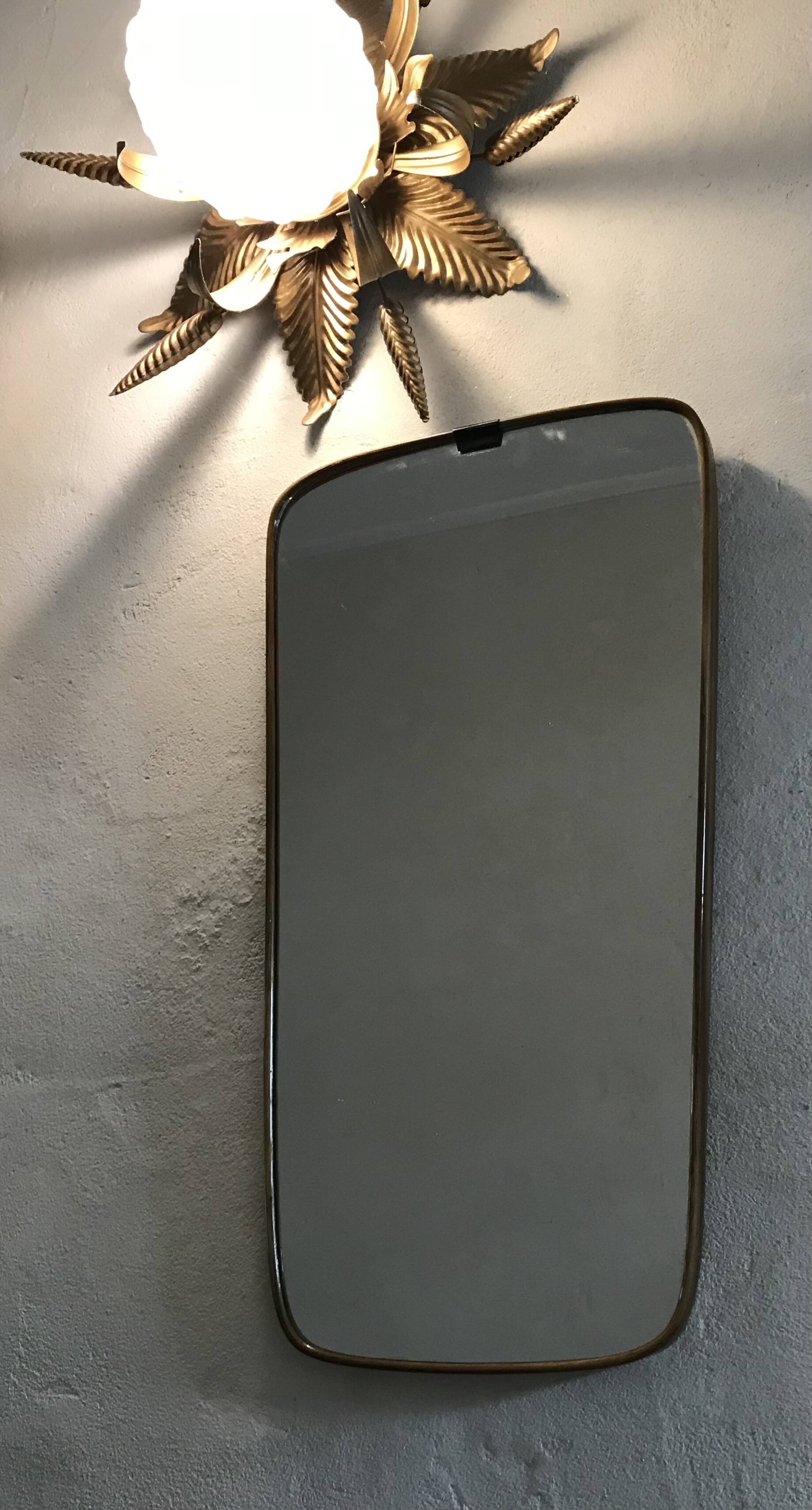 Vintage 1960 free-form mirror known as a rear-view mirror.