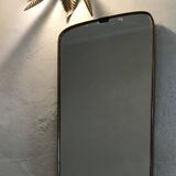 Vintage 1960 free-form mirror known as a rear-view mirror.