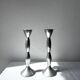 Pair of wavy aluminium candle holders