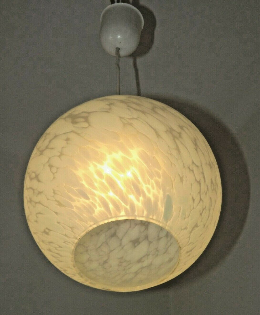 French suspended ceiling light in the shape of a white ball, Clichy 3336 glass shade.