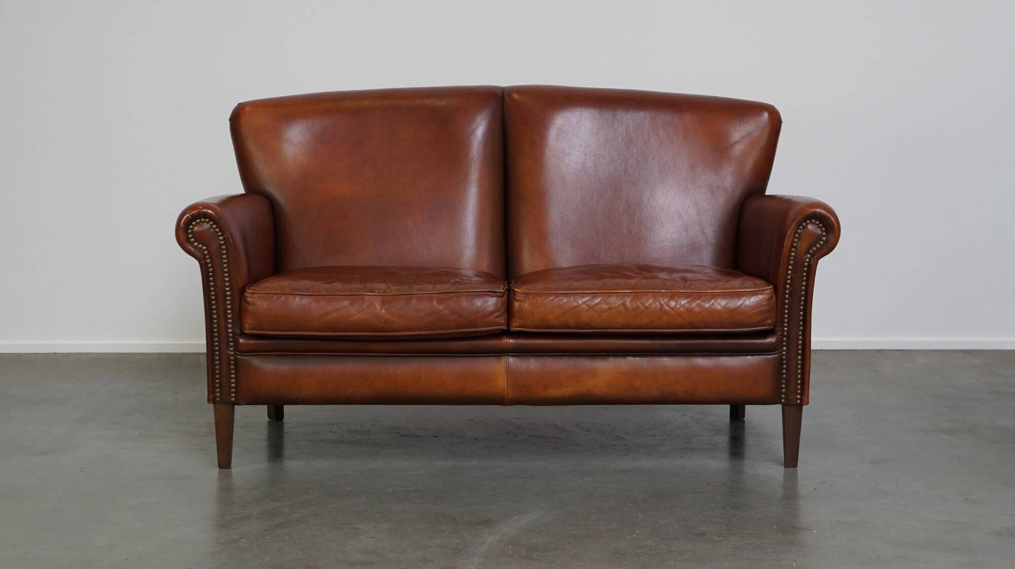 Classic 2 seater sheepskin sofa with beautiful colours and good seating comfort