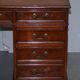 Partner desk with double pedestal in burr yew wood with decorated top.