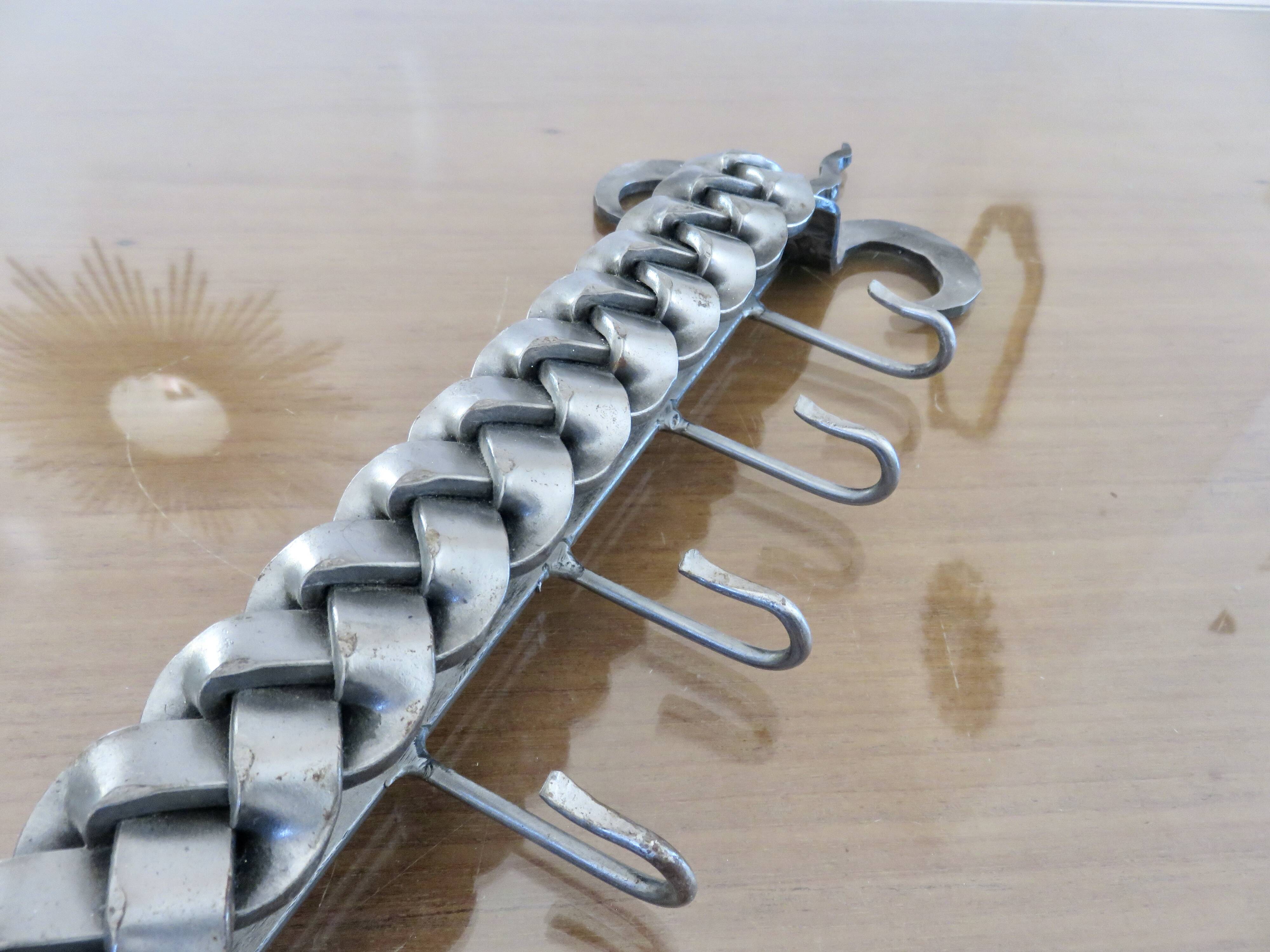 2 Tea towel holders, ironwork in braided raw steel, 1970