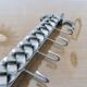 2 Tea towel holders, ironwork in braided raw steel, 1970
