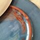 Set of 6 cream and grey-blue glazed earthenware plates.