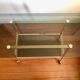 Smoked glass and gilded brass trolley
