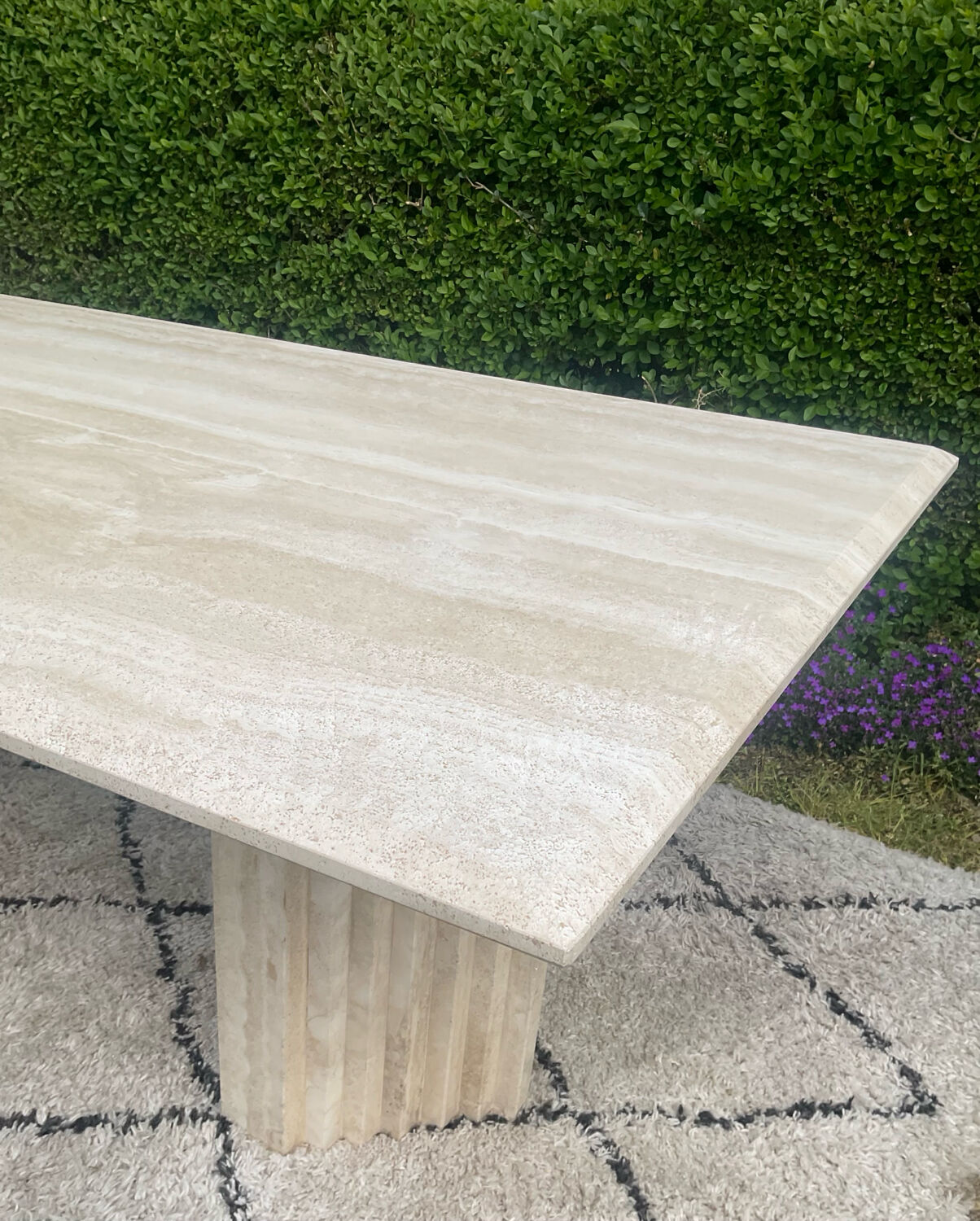Large vintage dining table in travertine in the 1970s Carpa style.