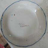 Decorative earthenware plate signed